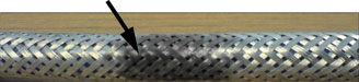 Figure 3. Shown here is one cable not designed for VSD use. High voltage has burned through the cable in several spots
